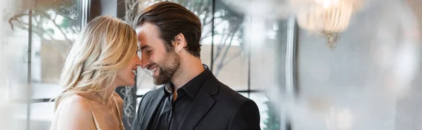 Side view of happy romantic couple smiling in restaurant, banner — Stock Photo