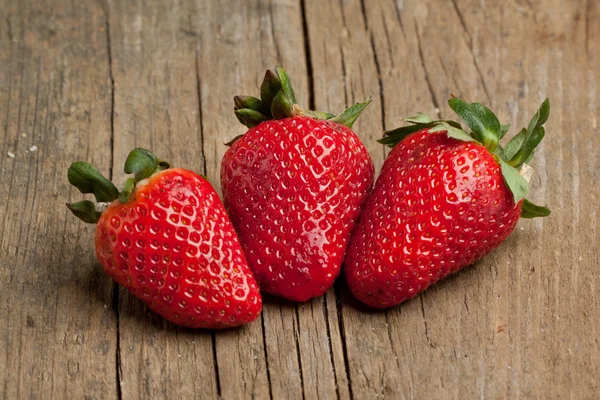 Three fresh strawberries — Stock Photo, Image