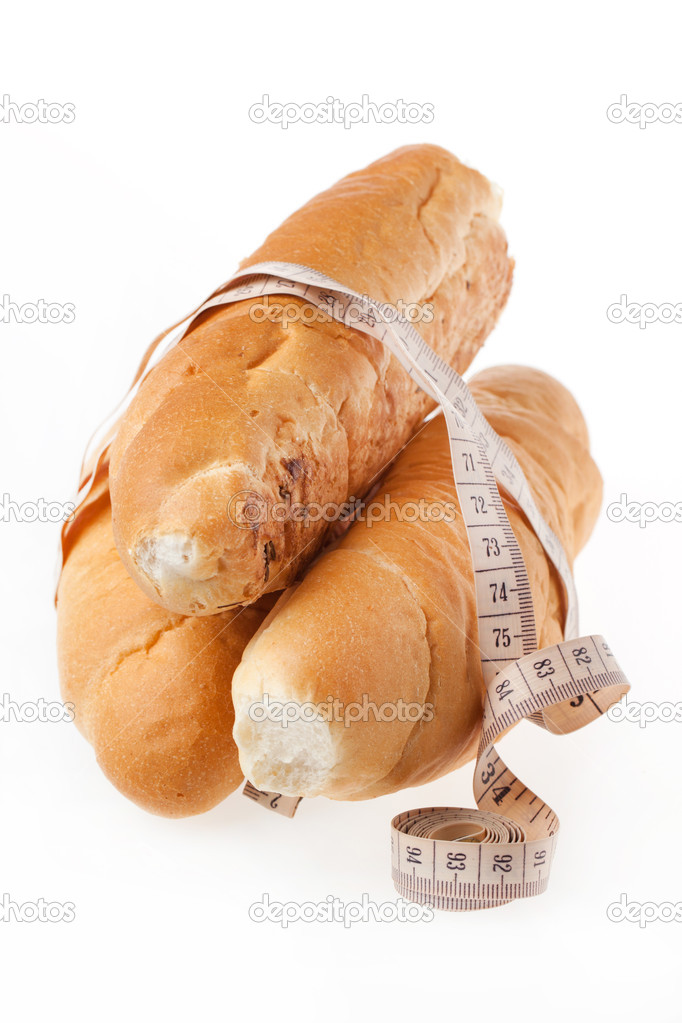 Fresh bread with measuring tape