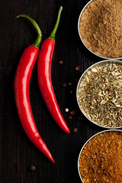 Red hot chili peppers and spices — Stock Photo, Image