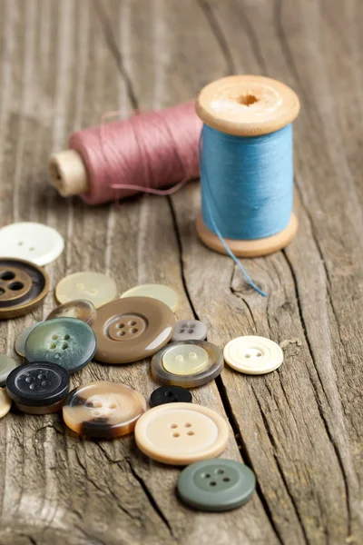 Spools of threads and buttons — Stock Photo, Image