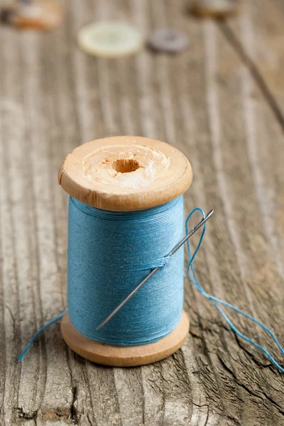 Spool of thread and needle — Stock Photo, Image