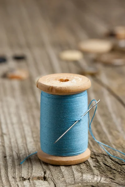 Spool of thread and needle — Stock Photo, Image