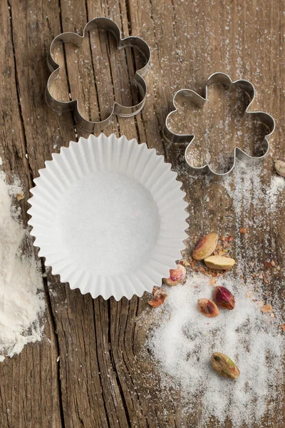 Dough, sugar and cookie cutters — Stock Photo, Image