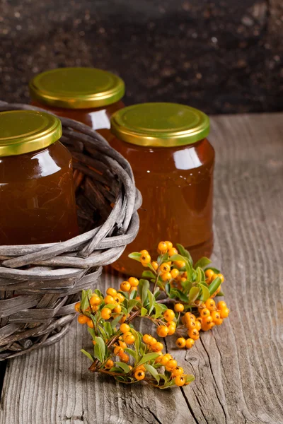 Pots with honey and berries — Stock Photo, Image