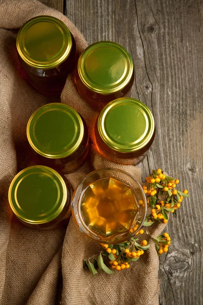 Pots with honey and berries — Stock Photo, Image