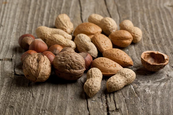 Assorted nuts almond, hazelnut, walnut and peanut — Stock Photo, Image