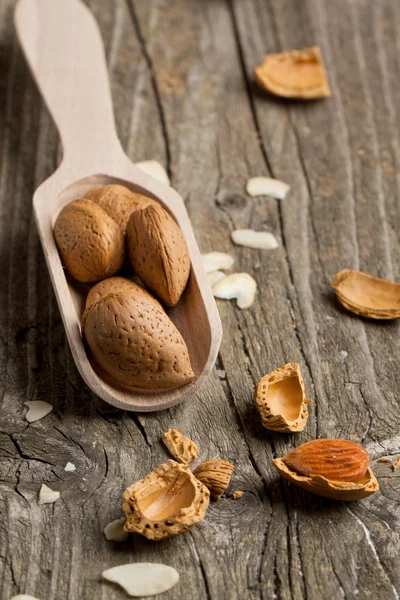 Almonds on wood — Stock Photo, Image