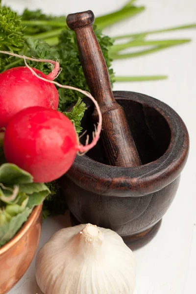 Vintage mortar with vegetables — Stock Photo, Image