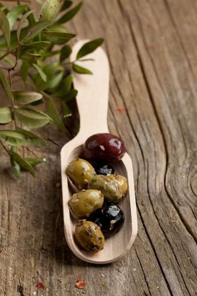 Spoon with olives — Stock Photo, Image