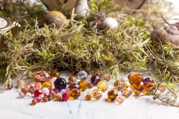 Colorful glass beads with moss — Stock Photo, Image