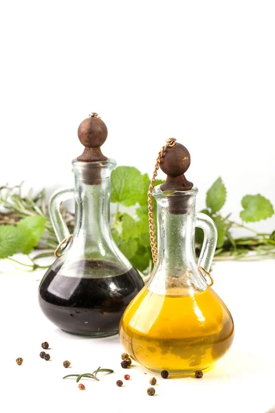 Olive oil and vinegar with herbs — Stock Photo, Image