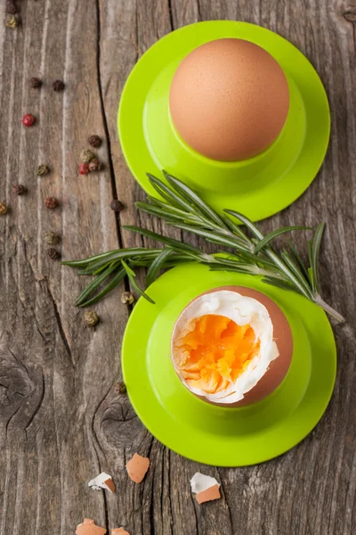 Boiled eggs and rosemary — Stock Photo, Image