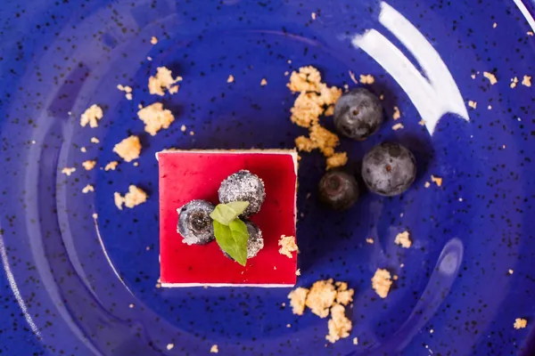 Dessert on blue plate — Stock Photo, Image