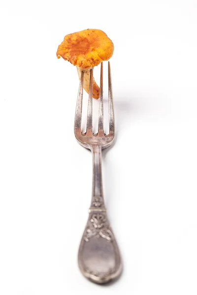 Vintage fork with chanterelle — Stock Photo, Image