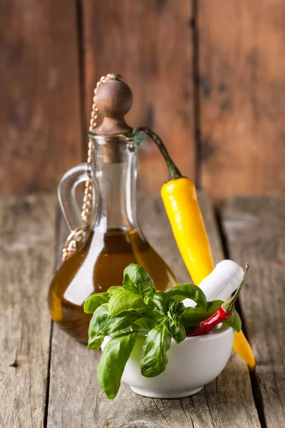 Basil with olive oil and chili pepper — Stock Photo, Image