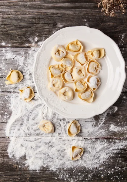 Pasta ravioli on flour — Stock Photo, Image