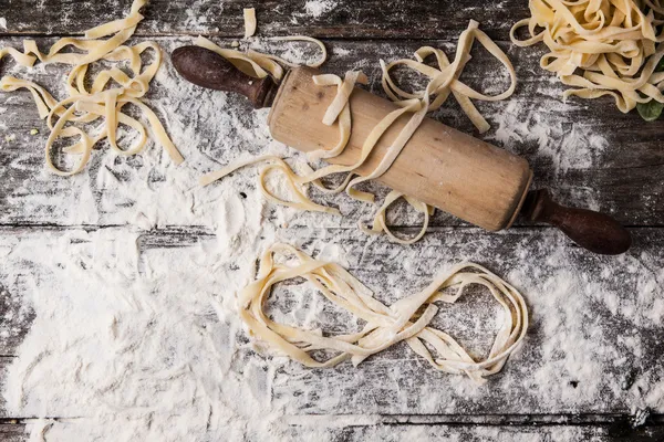 Raw homemade pasta with infinity symbol — Stock Photo, Image