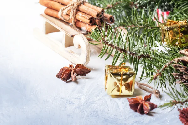 Christmas card with sled and cinnamon — Stock Photo, Image