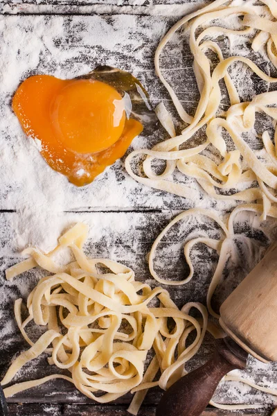 Raw homemade pasta with with egg yolk as heart — Stock Photo, Image