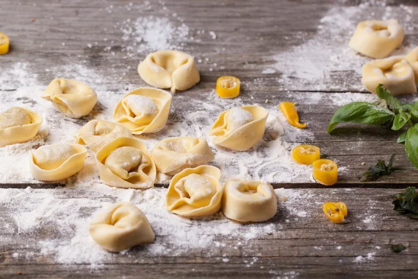 Pasta ravioli on flour — Stock Photo, Image