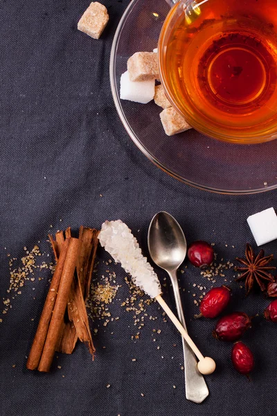 Cup of tea with sugar and spices — Stock Photo, Image