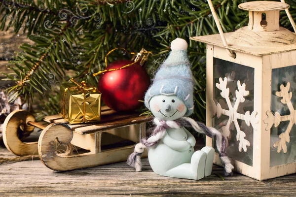 Christmas lantern with christmas tree and snowman Stock Image