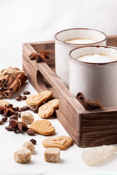 Tow cup of cappuccino with cookies as hearts — Stock Photo, Image
