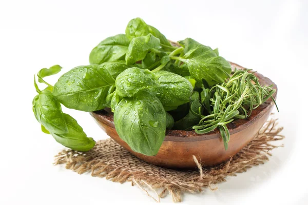 Bowl of basil and rosemary — Stock Photo, Image