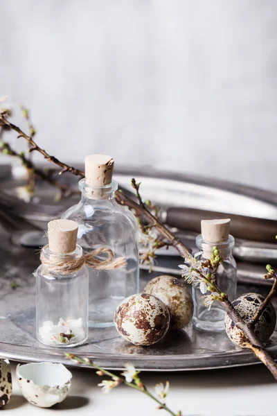 Easter interior with vials and quail eggs — Stock Photo, Image
