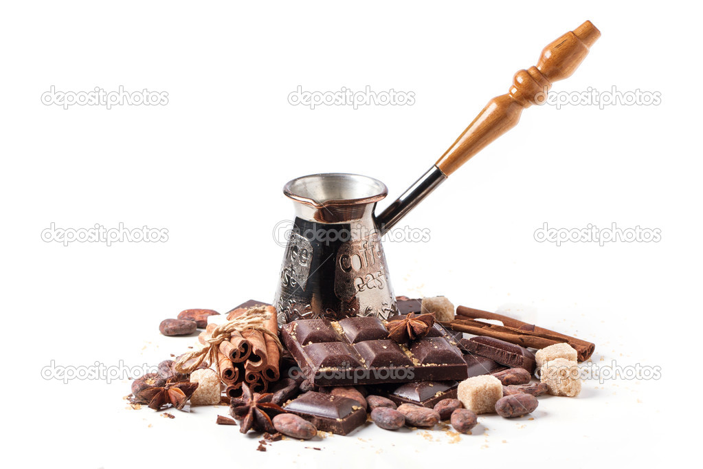 Copper cezve with dark chocolate and cocoa beans