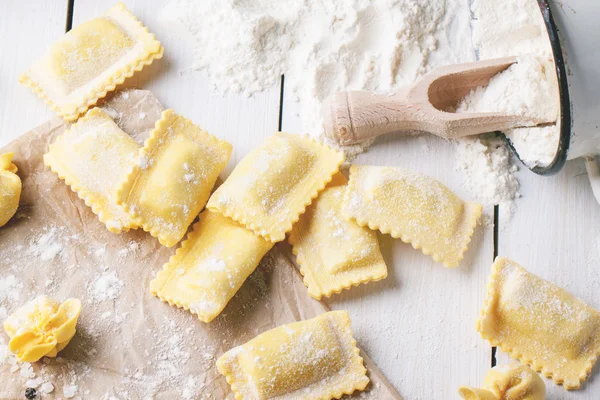 Pasta ravioli on flour — Stock Photo, Image