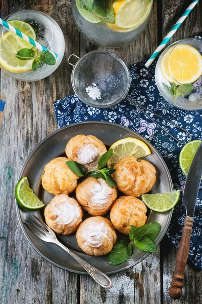 Cakes profiteroles with lemonade