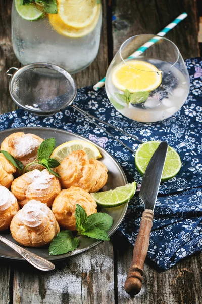 Cakes profiteroles with lemonade