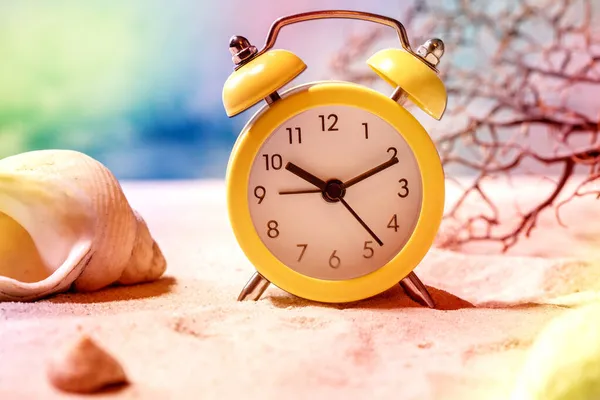 Yellow Alarm Clock Summer Sand Sea Beach Waves Seashells Background — Stock Photo, Image