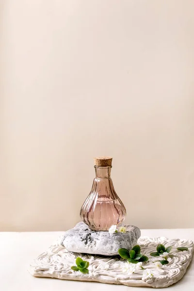 Elegance Pink Transparent Bottle Perfume Cork Standing Textured Stone White — Stock Photo, Image