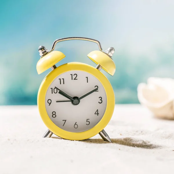 Yellow Alarm Clock Summer Sand Sea Beach Waves Seashells Background — Stock Photo, Image