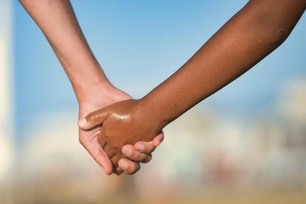 Detail Hands Crossing Caucasian Woman Dark Skinned Child — Zdjęcie stockowe