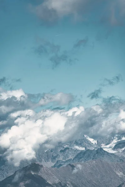 Stock image Vertical cloudscape over the mountains of northern Italy