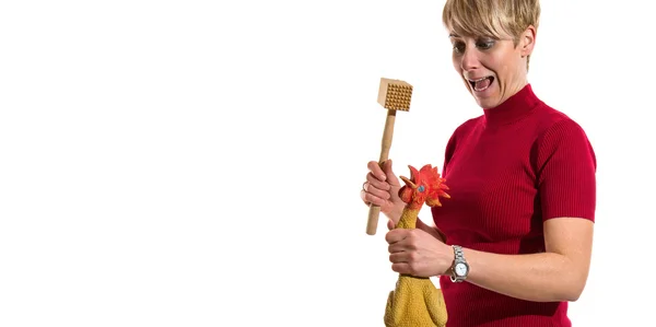 Woman with latex chicken — Stock Photo, Image