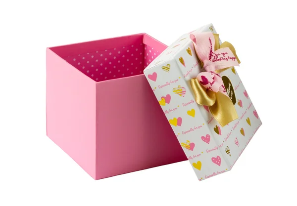 Öppna rosa presentförpackning med guld och rosa rosetter — Stockfoto