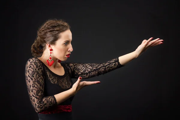 Portrait of spanish woman dancing flamenco on black — Stock Photo, Image