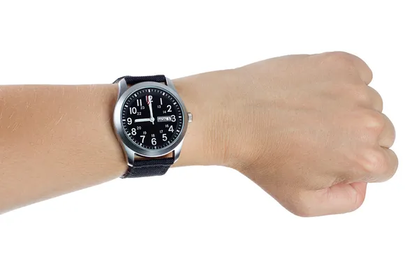 Eine Hand trägt eine schwarze Armbanduhr lizenzfreie Stockbilder