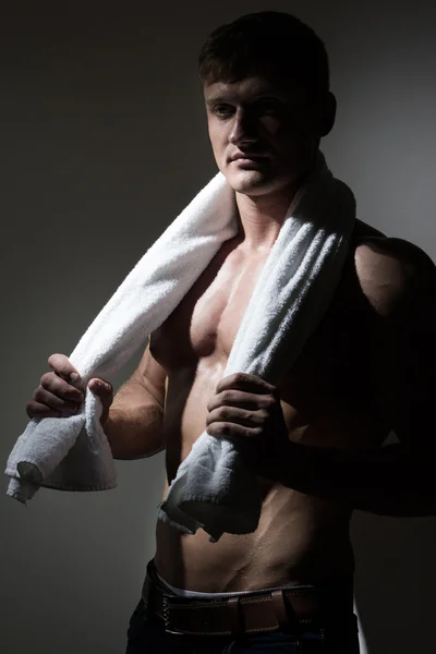 Young man with towel over his neck — Stock Photo, Image