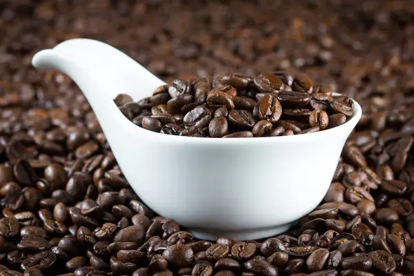 China bowl with coffee beans — Stock Photo, Image