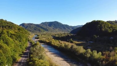 Picturesque View of Glacial River from Above surrounded by Mountains. Aerial Drone Shot. Northern Rockies, Karpatian. 4K High quality 4k footage