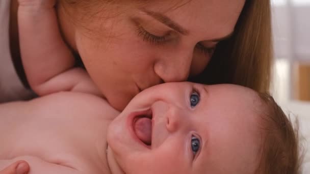 Young Loving Mother Brunette Short Hair Plays Newborn Son Grey — Stock Video