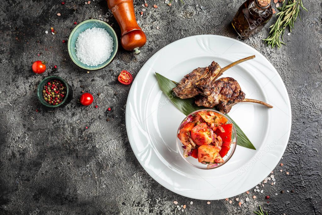Grilled Lamb Chops with vegetable salad with tomatoes, banner, menu, recipe place for text, top view.