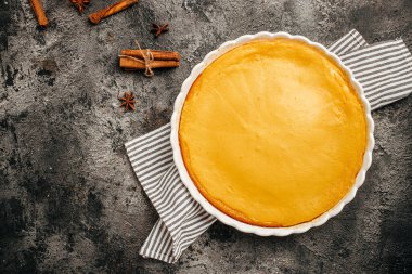 Pumpkin Pie with cinnamon for Thanksgiving, traditional Pumpkin Pie. banner, menu, recipe place for text, top view,