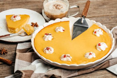 Sliced pumpkin tart cake sweet dessert, Homemade pastry for Thanksgiving. Pumpkin cheesecake,